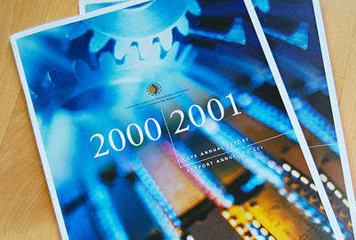 Two covers of the Canadian Counsel of Professional Engineers annual report featuring an image of blue gears merging into gold circuit boards.