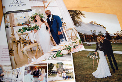 Cover and interior spread of a Stonefields Estate wedding brochure - with happy couples